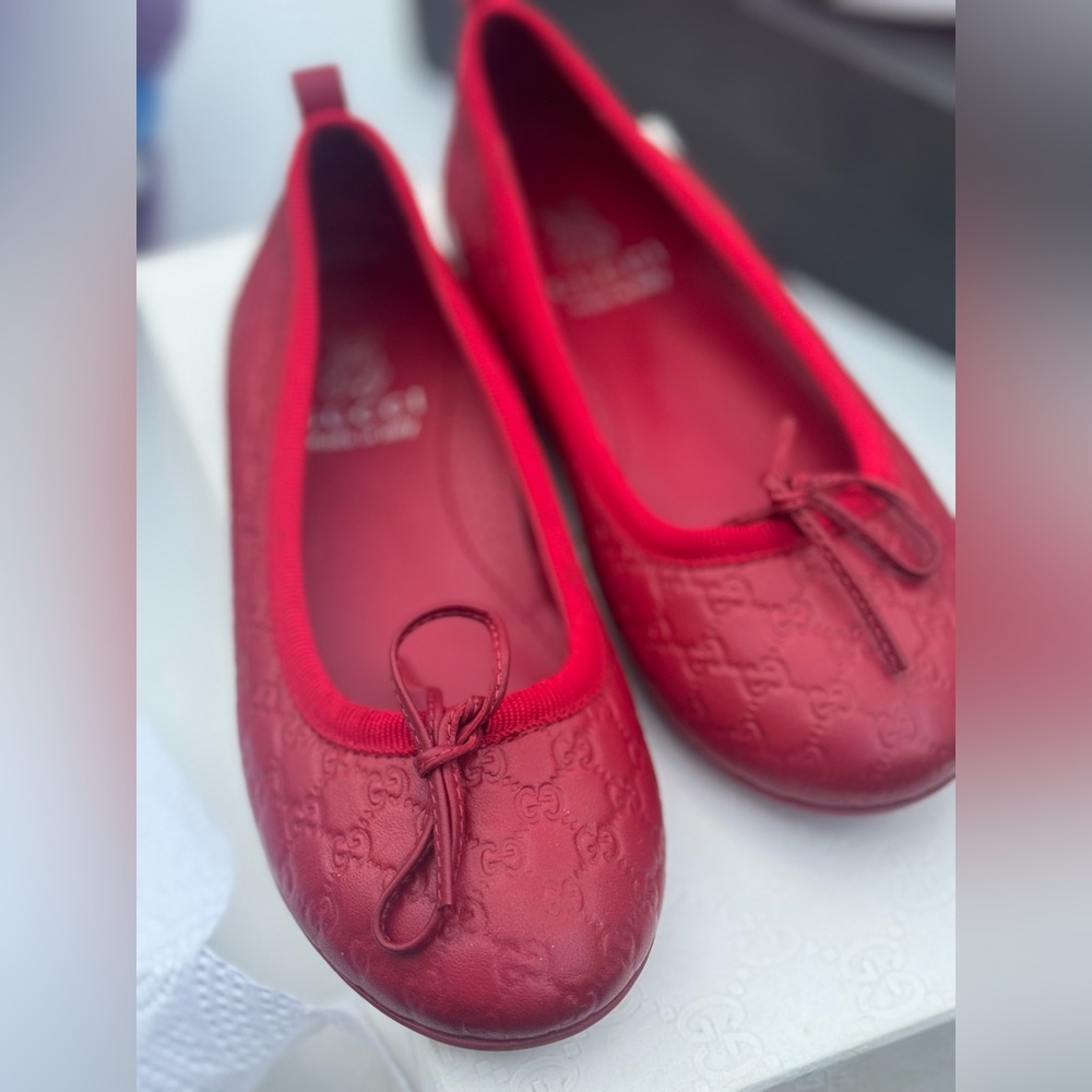 Pair of red toddler gucci shoes